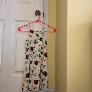 white dress with floral patterns